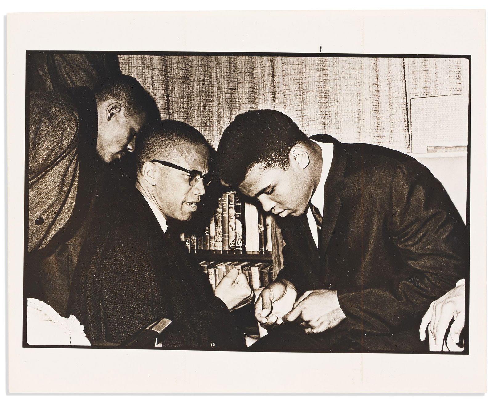 (MALCOLM X.) Photographs showing Malcolm X, Elijah Muhammad, Muhammad Ali, and more, 1961-1972: (MALCOLM X.)File of photographs and transparencies showing Malcolm X, Elijah Muhammad, Muhammad Ali, and more.Various places, 1961-197220 items in one folder: Partly printed filing pouch with 4 M
