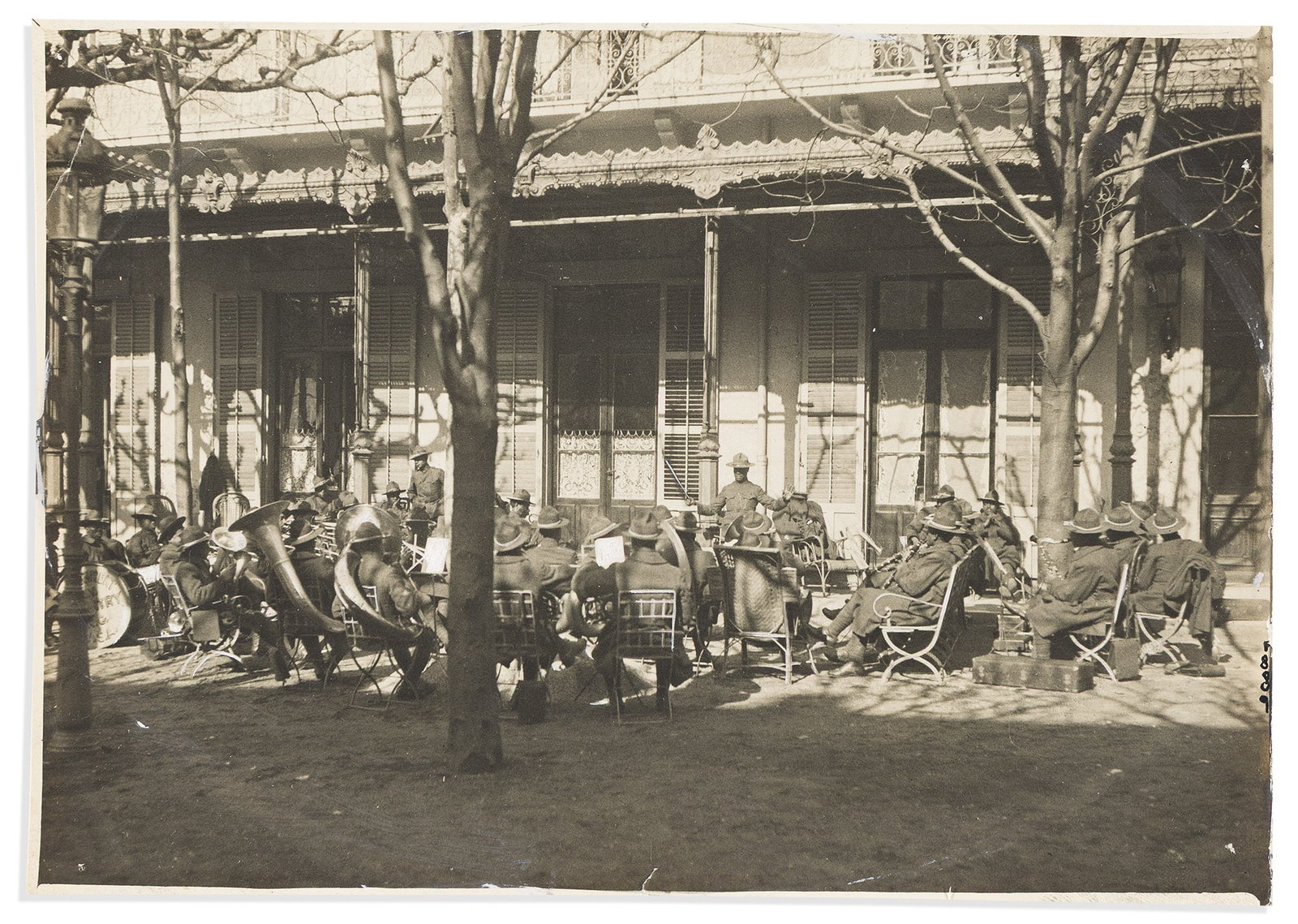 (MILITARY--WORLD WAR ONE.) Photograph of a military band performing in Paris during the war, circa: (MILITARY--WORLD WAR ONE.) Photograph of a military band performing in Paris during the war. Paris, circa 1917-1918 Photograph, 5 x 7 inches; minor wear; captioned in pencil on verso "Jazz band in the