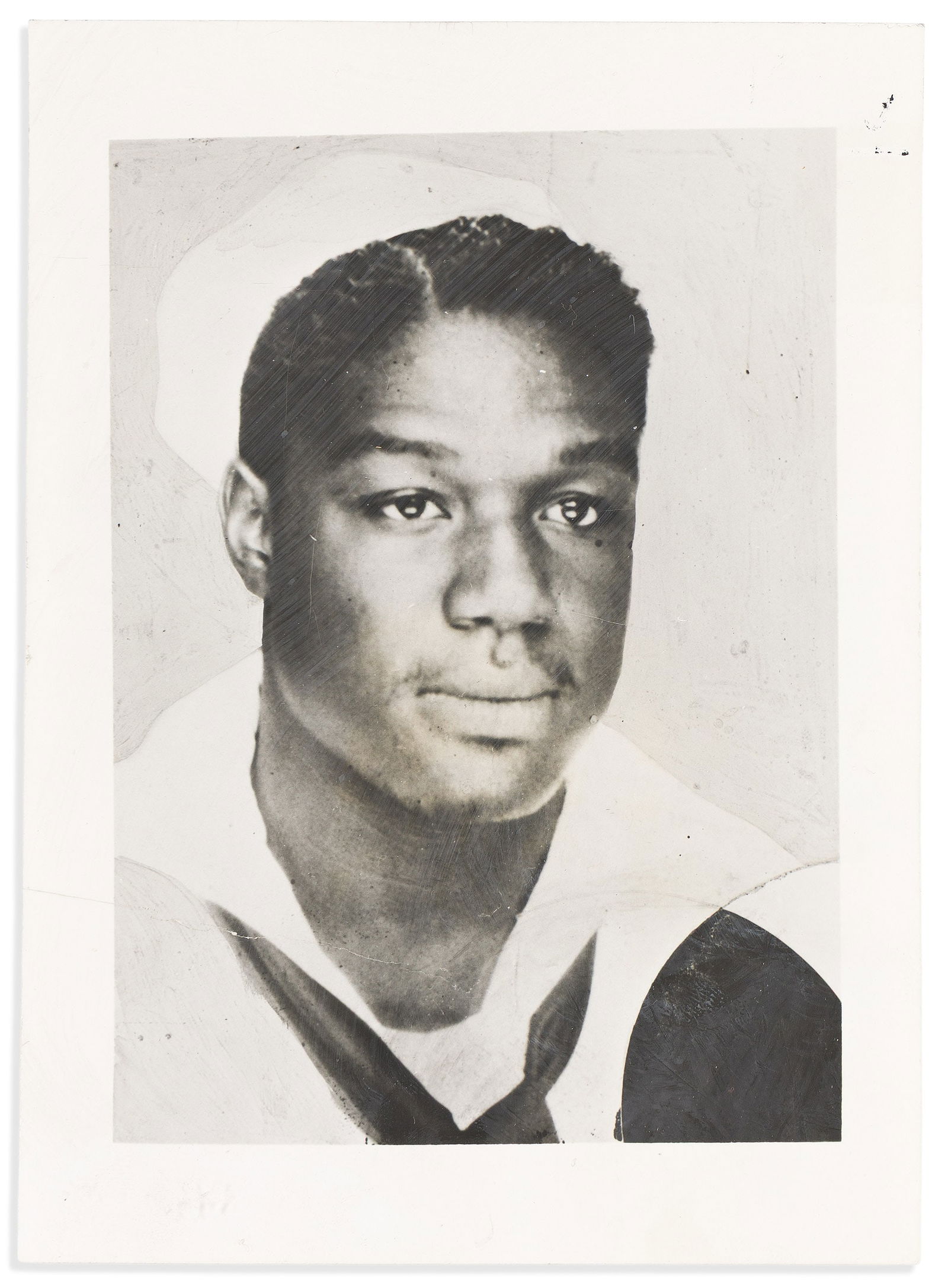 (MILITARY--WORLD WAR TWO.) Early press photo of Pearl Harbor hero Dorie Miler, 17 March 19442: (MILITARY--WORLD WAR TWO.)Early press photo of Pearl Harbor hero Dorie Miler.No place, 17 March 1942Photograph, 7 x 5 inches; several partial creases; news agency stamps, captioning, related clipping,