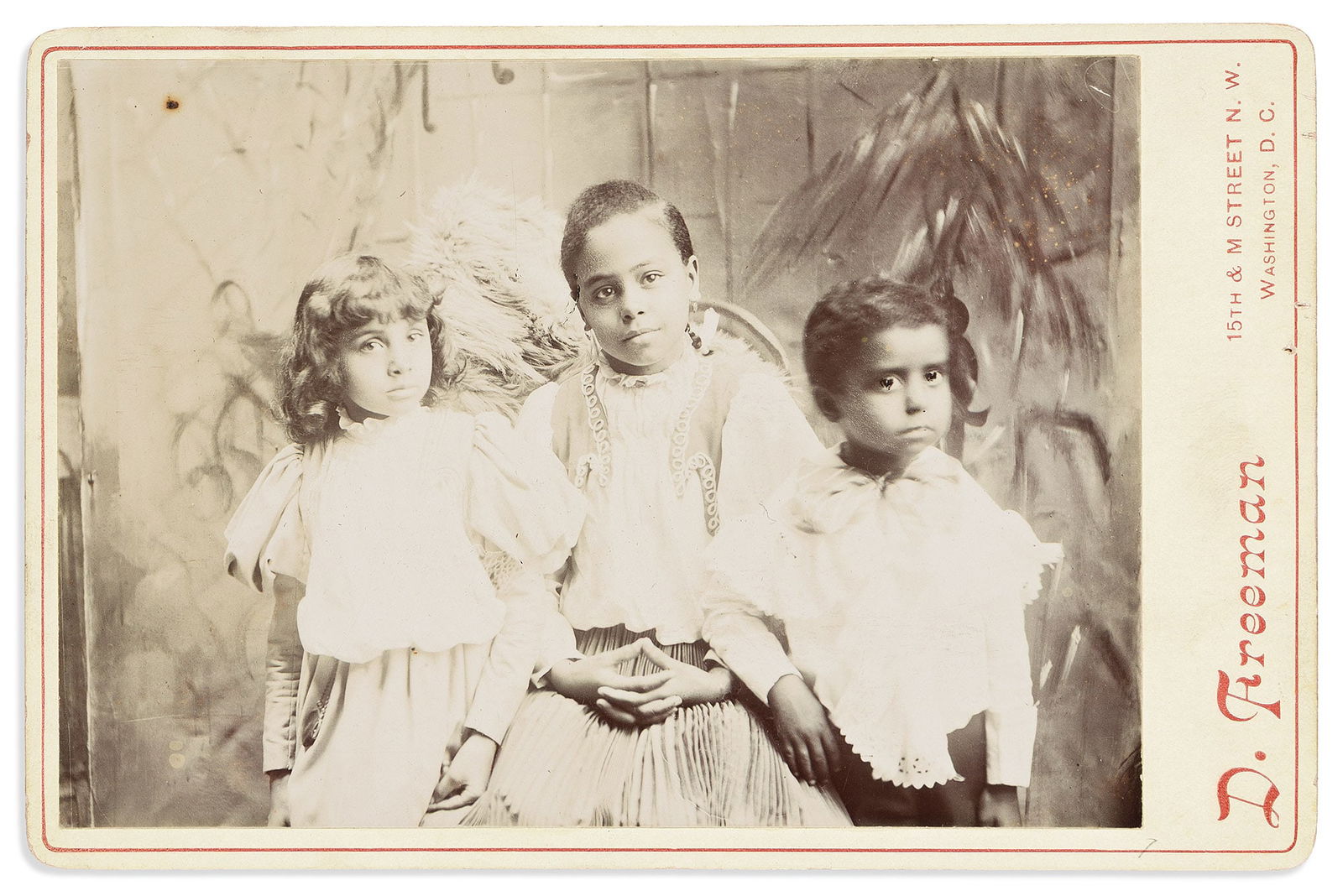 (PHOTOGRAPHY.) Daniel Freeman, photographer. Cabinet card of three children. Washington, circa (1 of 1)