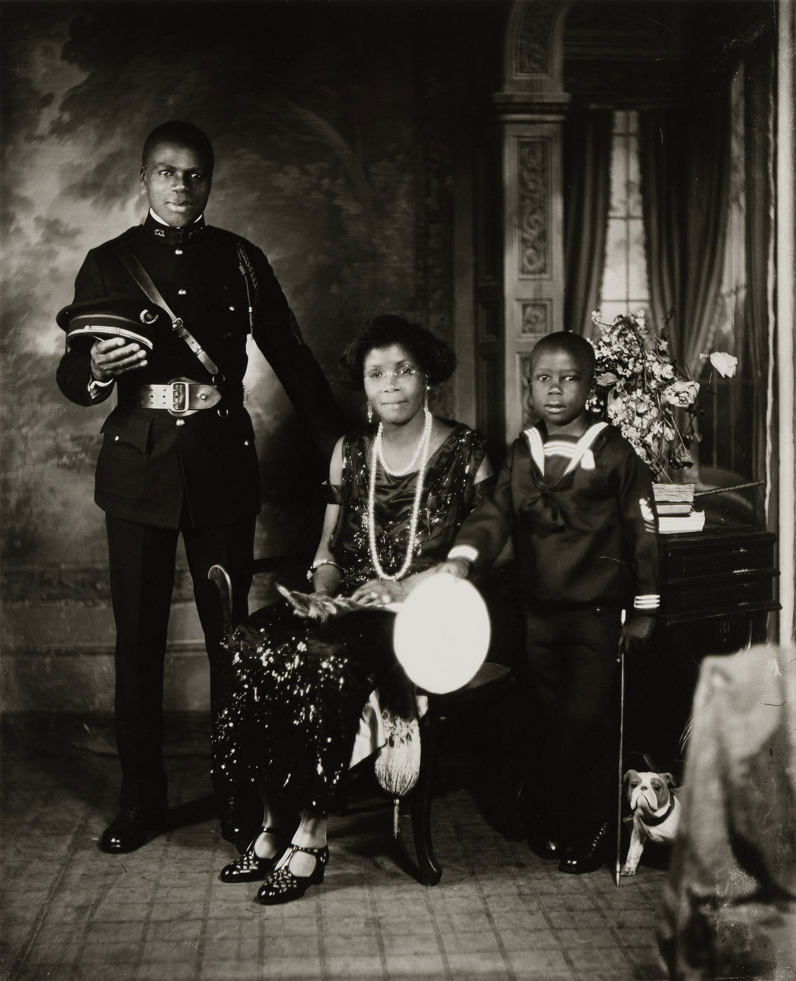 James Vanderzee (1886-1986), Untitled (Garveyite Family, Harlem), 1924.: James VanDerZee (1886-1986) Untitled (Garveyite Family, Harlem). Silver print, 1924. Signed and numbered VIII and 25/75 in pencil on the mount. Published by Graphics International Ltd., Washington, DC