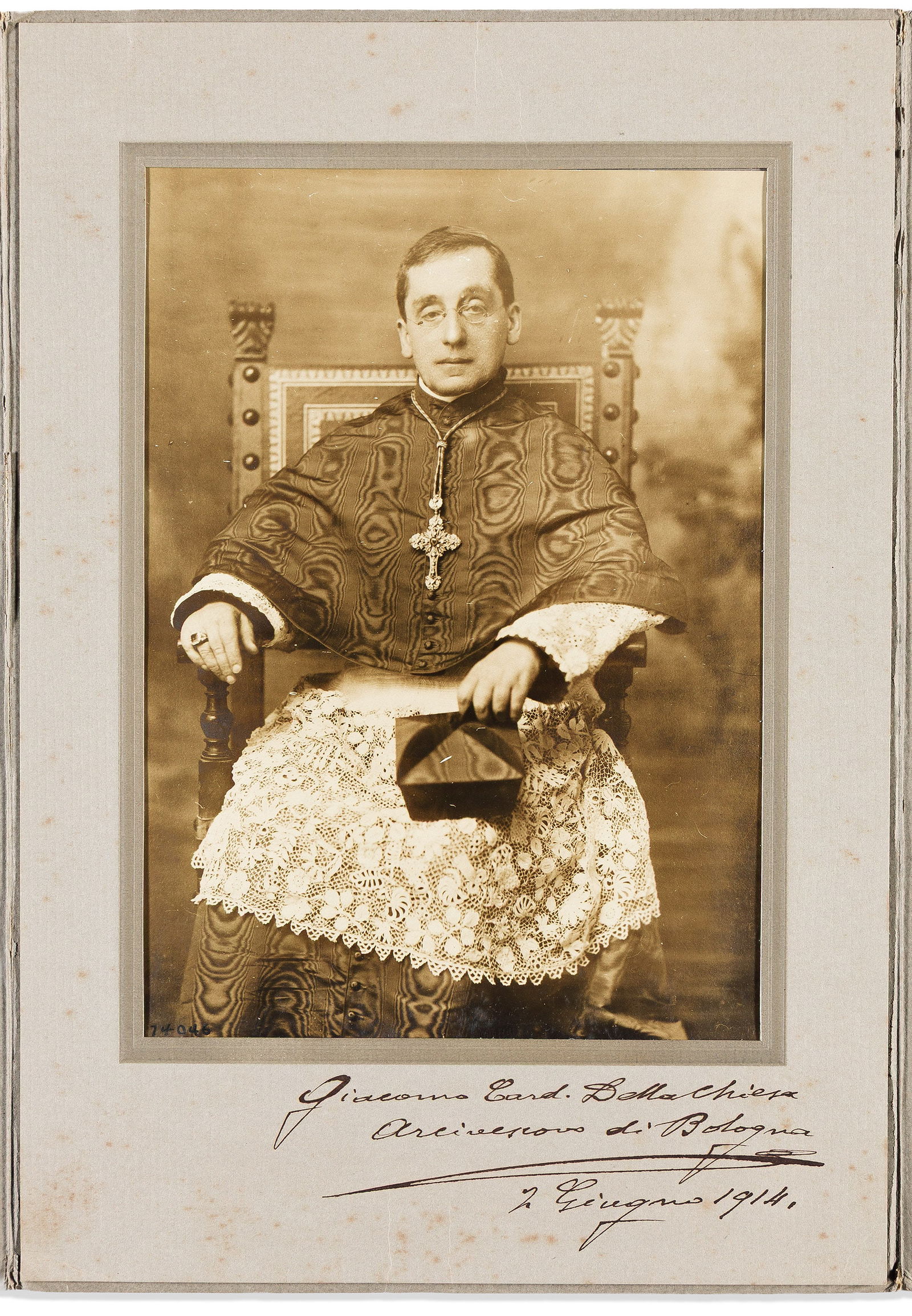 Benedict XV; Pope. Photograph dated and Signed, "Giacomo Card. Della Chiesa / Arcivescovo di: Benedict XV; Pope Photograph dated and Signed, "Giacomo Card. Della Chiesa / Arcivescovo di Bologna," half-length portrait by Underwood & Underwood, showing him seated, wearing Cardinal's garb, ho
