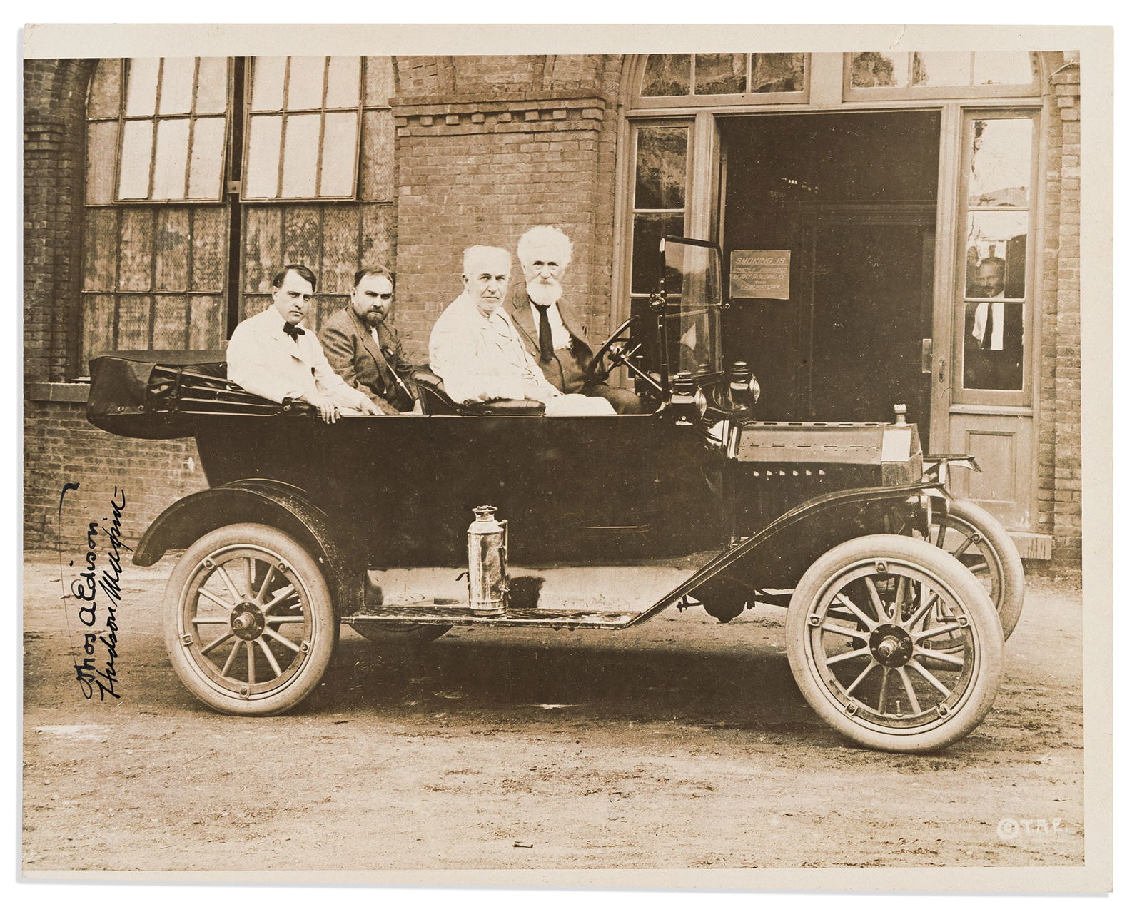 Thomas A. Edison; and Hudson Maxim. Photograph Signed, by both, with Edison including his "umbrella": Thomas A. Edison; and Hudson Maxim Photograph Signed, by both, with Edison including his "umbrella" paraph, group portrait by Underwood & Underwood, showing Edison and Maxim sitting in the front s