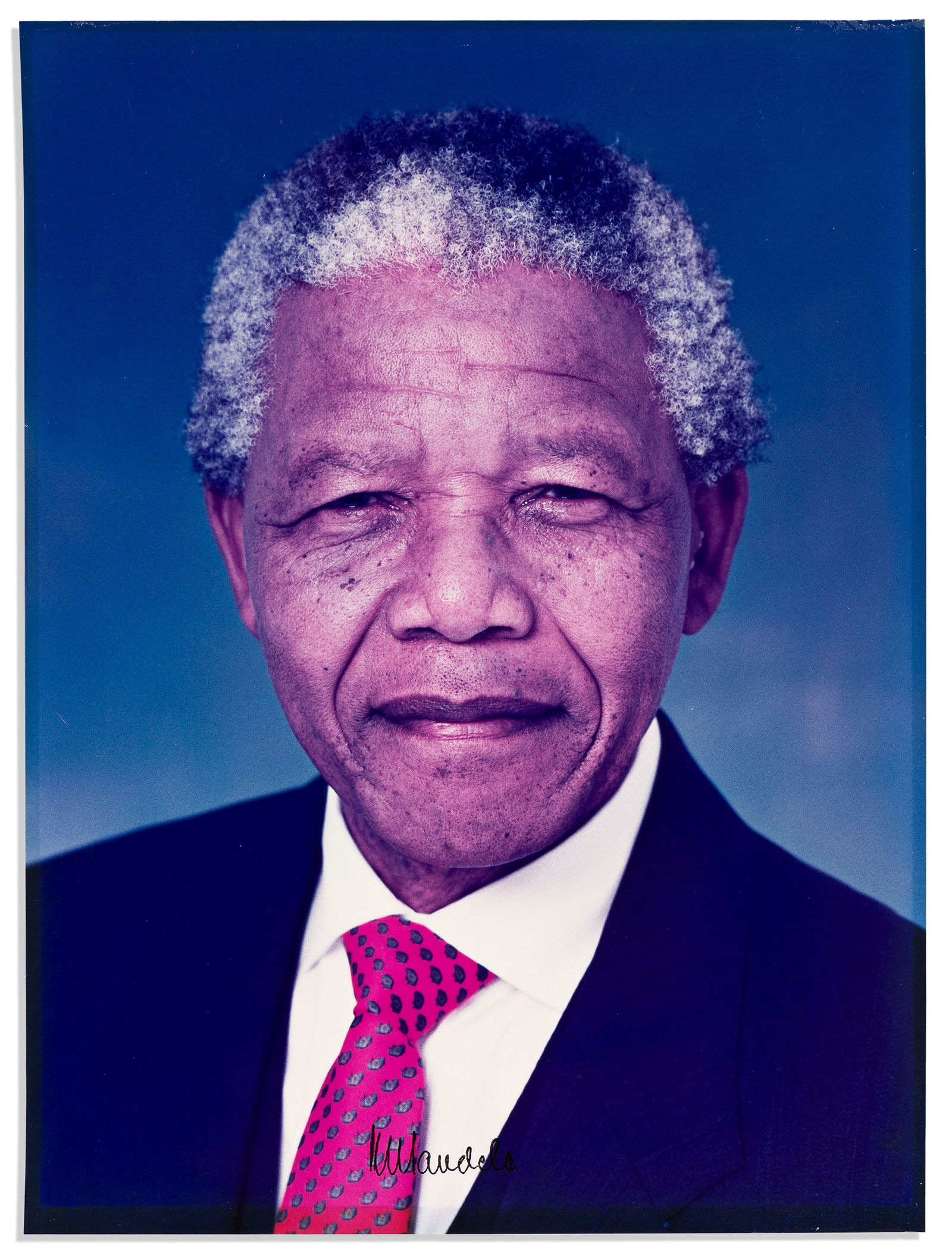 Nelson Mandela. Large color Photograph Signed, "NMandela,": Nelson Mandela Large color Photograph Signed, "NMandela," bust portrait showing him looking into the camera. Signed in the image at lower center. 16x12 inches; faint marginal discoloration from prior