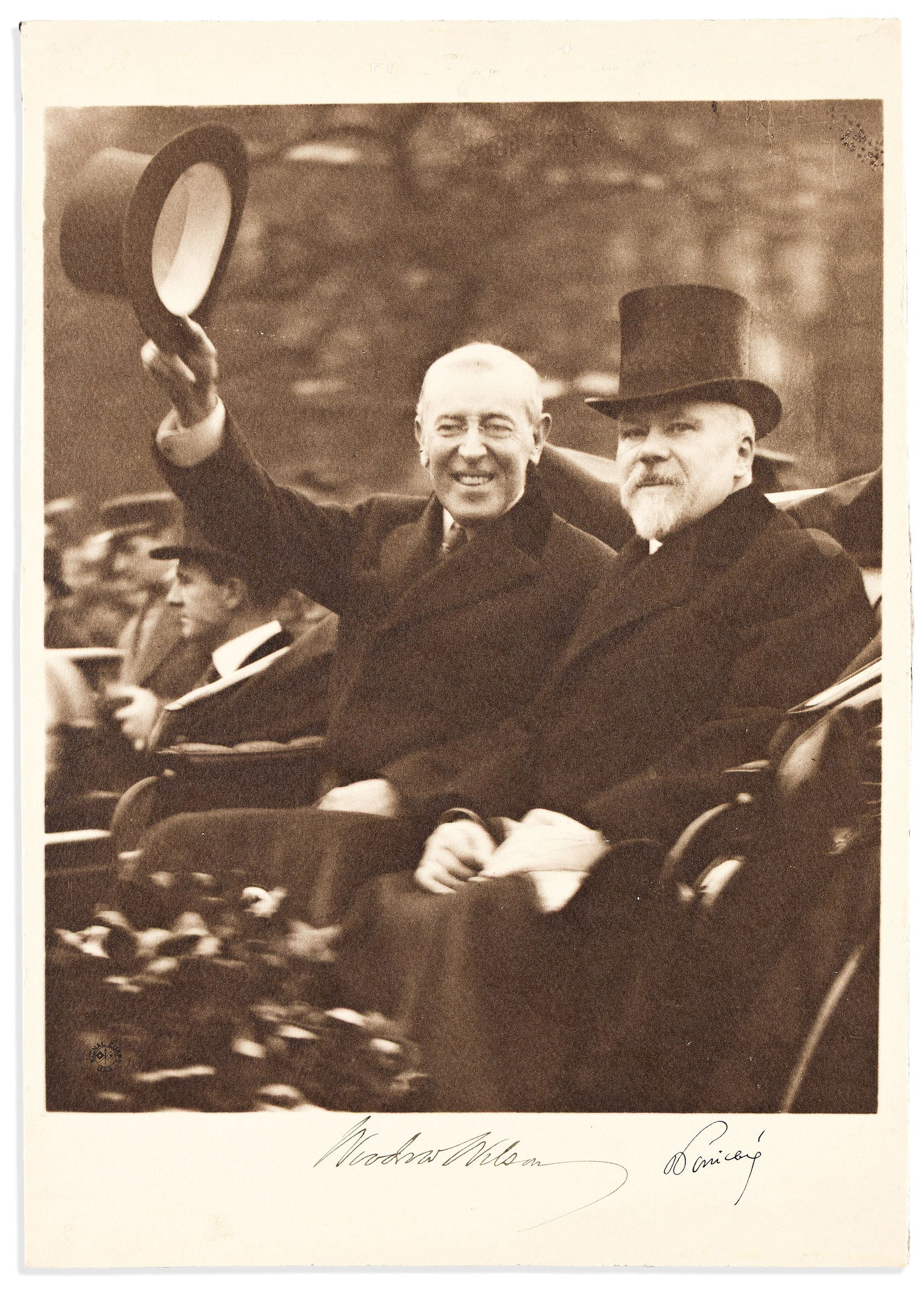 Woodrow Wilson; and Raymond Poincaré. Photograph Signed, by both: Woodrow Wilson; and Raymond Poincaré Photograph Signed, by both, half-length portrait by the U.S. Army Signal Corps showing them seated in a carriage in December, 1918, during Wilson's visit to P