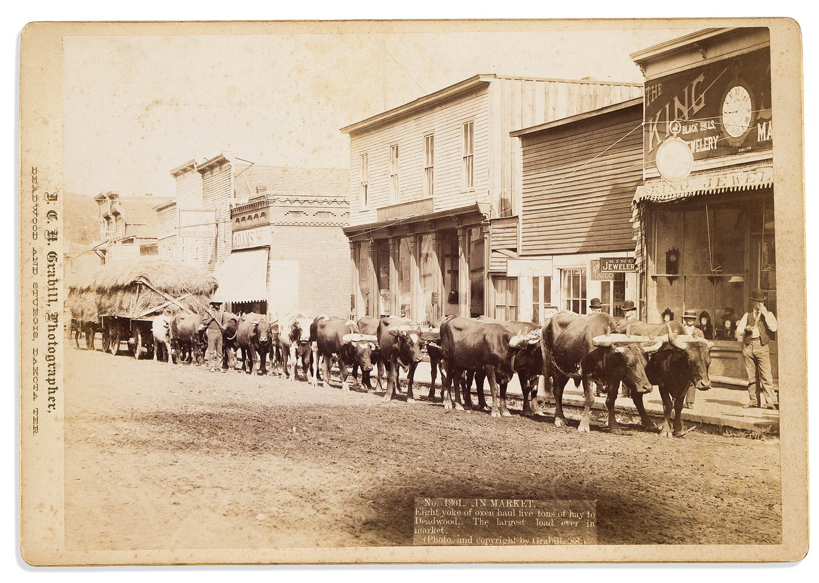 (WEST--DAKOTA TERRITORY.) John C.H. Grabill. In Market. Sturgis, SD, 1888: John C.H. Grabill. In Market. Sturgis, SD, 1888 Albumen photograph, 6¼ x 8¾ inches, on photographer's printed mount, captioned in negative; minimal wear, red "3" inked on verso. The caption 