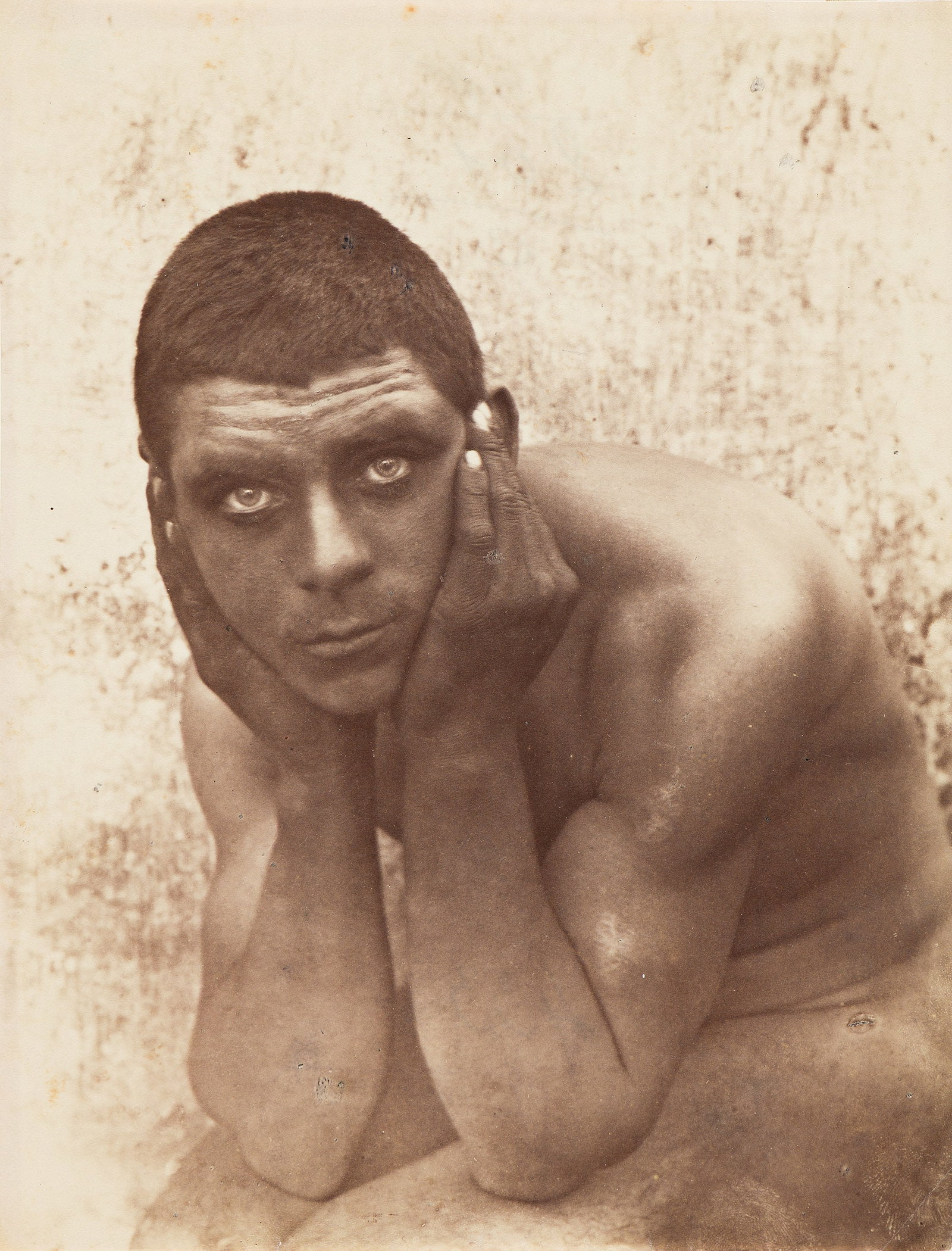 Wilhelm von Gloeden, Seated Male Nude. Circa 1900-1910.: Wilhelm von Gloeden 1856-1931 Seated male nude. Circa 1900-1910. Albumen print With von Gloeden's Taormina stamps (two) and catalog number 433 in blue grease pencil on verso. The image 6 5/8 x 8 3/4 i
