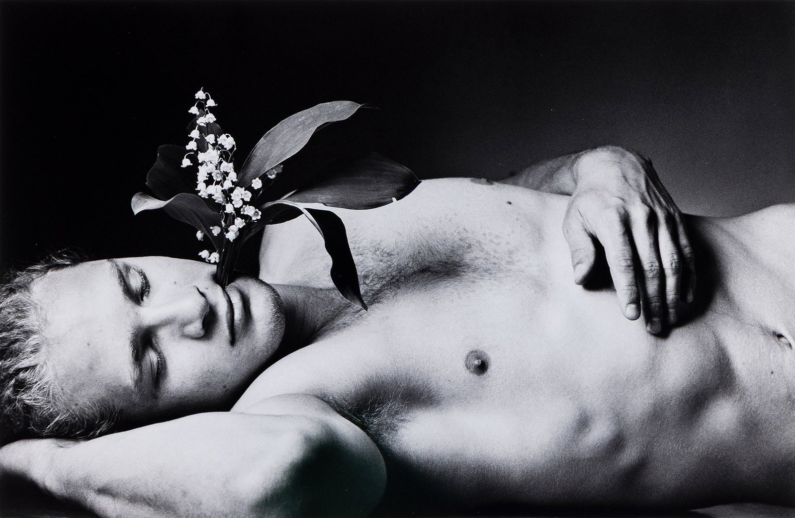 Duane Michals, Young Soldiers Dream in the Garden of the Dead with Flowers Growing from Their Heads.: Duane Michals 1932-2026 Young Soldiers Dream in the Garden of the Dead with Flowers Growing from Their Heads. 1995; printed later. Archival pigment print With an Aperture label with Michals' signature