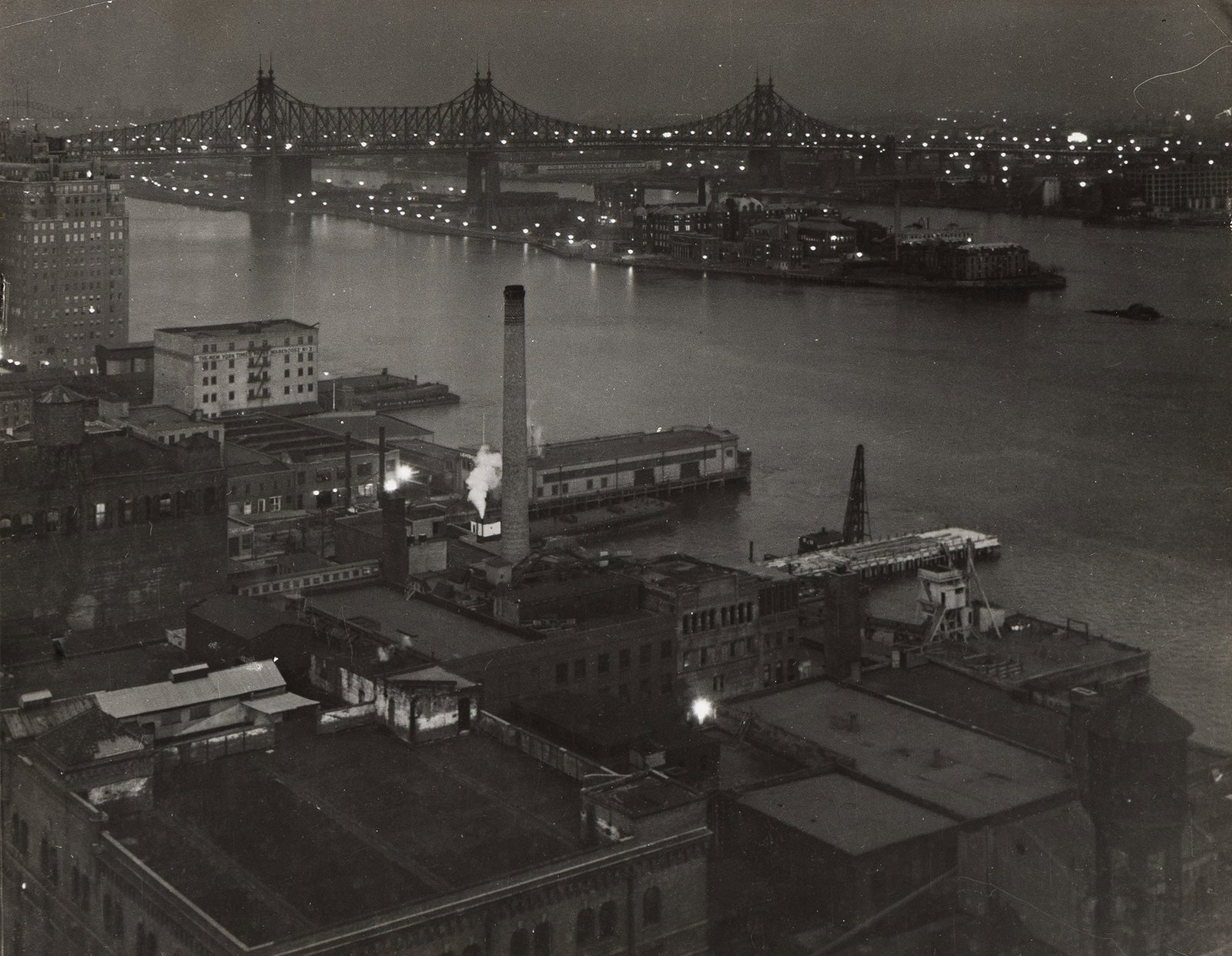 Underwood & Underwood, Queensboro Bridge at Night, 1930s.: Underwood & Underwood Queensboro Bridge at Night. 1930s. Silver ferrotyped print. With the Underwood & Underwood News stamp (twice) and a caption in pencil, on verso. The image 7 1/2 x 9 5/8 i
