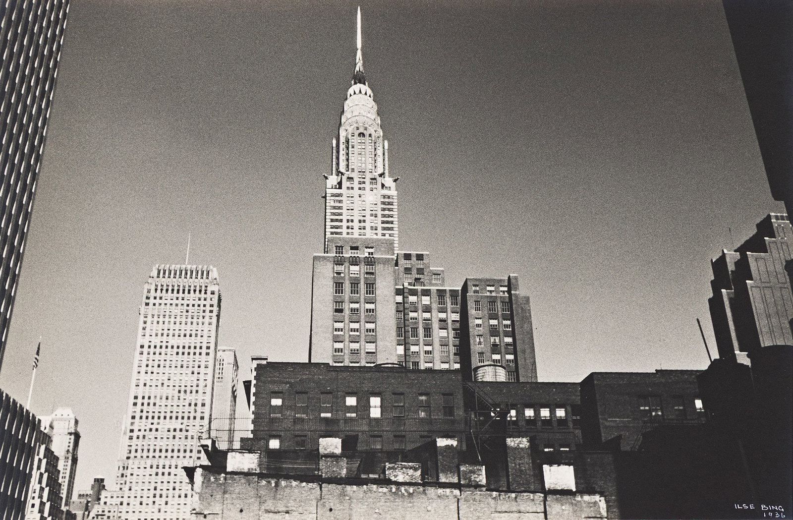 Ilse Bing, Chrysler Building, 1936.: Ilse Bing 1899-1998 Chrysler Building. 1936. Silver print. With Bing's signature and date in ink on recto. The image 7 1/4 x 11 in. (18.4 x 27.9 cm.) Additional Details Provenance: