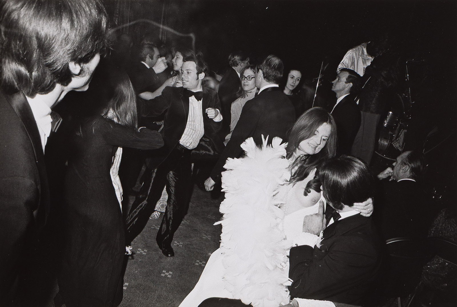 Garry Winogrand, Metropolitan Museum of Art Centennial Ball, New York City, New York, 1970.: Garry Winogrand 1928-1984 Metropolitan Museum of Art Centennial Ball, New York City, New York. 1970. Silver print. With Winogrand's signature in pencil on mount recto. The image 8 5/8 x 12 3/4 in. (21