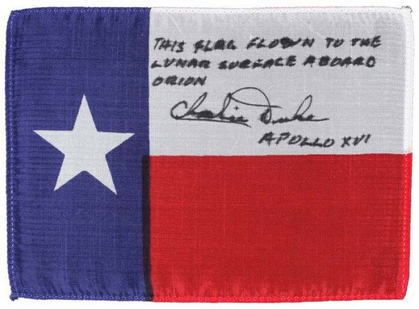 FLOWN Texas State Flag from Apollo 16. An appr: FLOWN Texas State Flag from Apollo 16. An approximately 6x4 inch silk flag carried to the lunar surface. NASA/MSC, 1972 The flag has been inscribed and signed: "This flag flown to the lunar surface
