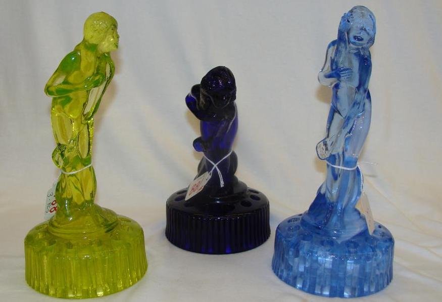 3 Art Glass Bashful Charlotte Flower Frogs; Vaseline Co: 3 Art Glass Bashful Charlotte Flower Frogs; Vaseline Color, Pale Blue & Cobalt Blue. Auction Estimate $100-200.