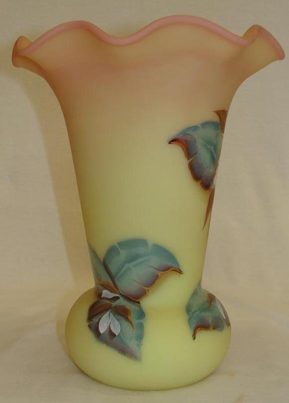 Fenton Art Glass Vase hand painted with Flowers on a Bu: Fenton Art Glass Vase hand painted with Flowers on a Burmese Background. 9.5" Ht. Auction Estimate $50- 100.