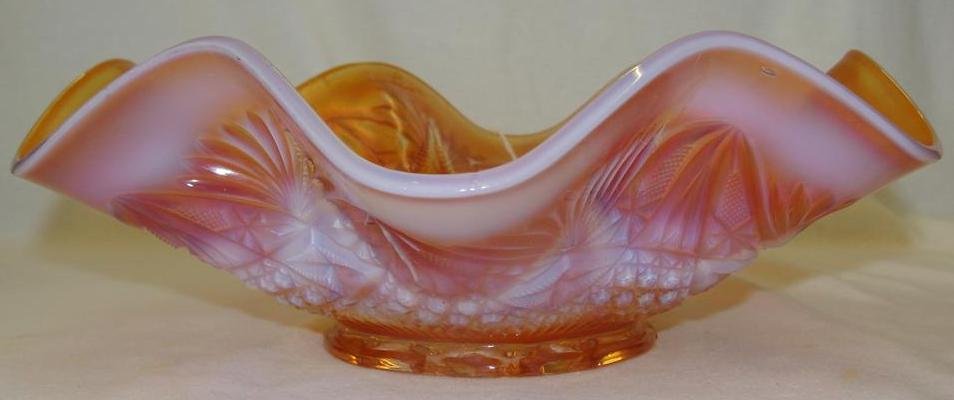 Antique Opalescent Carnival Glass Bowl: Marigold color : Antique Opalescent Carnival Glass Bowl: Marigold color with Double Star Design Interior & Cross Hatching on Exterior with a Ruffled Top. 11" Diameter. Auction Estimate $50-100.