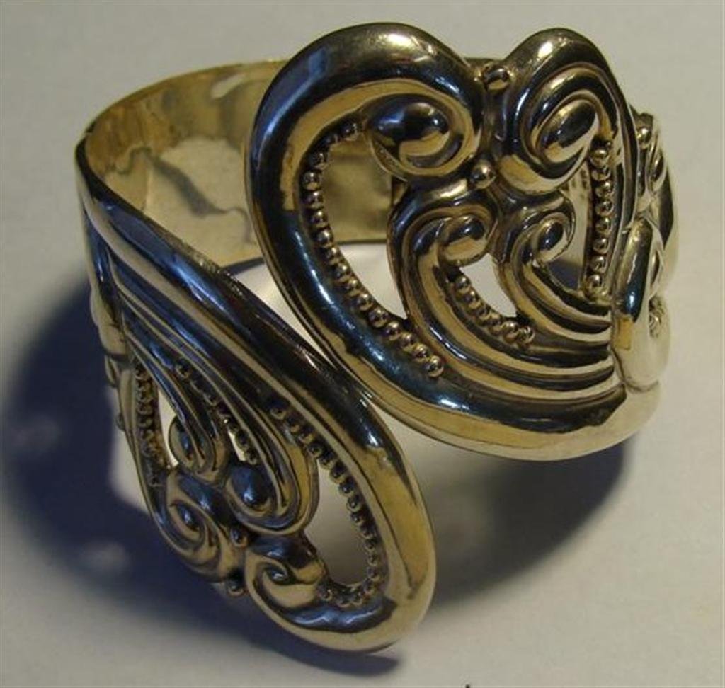 Sterling Silver Hinged Bracelet with Ornate Design on: Sterling Silver Hinged Bracelet with Ornate Design on Top, Signed on Interior, Taxco Sterling, JC, Hecho En Mexico. 66.2 Grams. Auction Estimate $100-200.