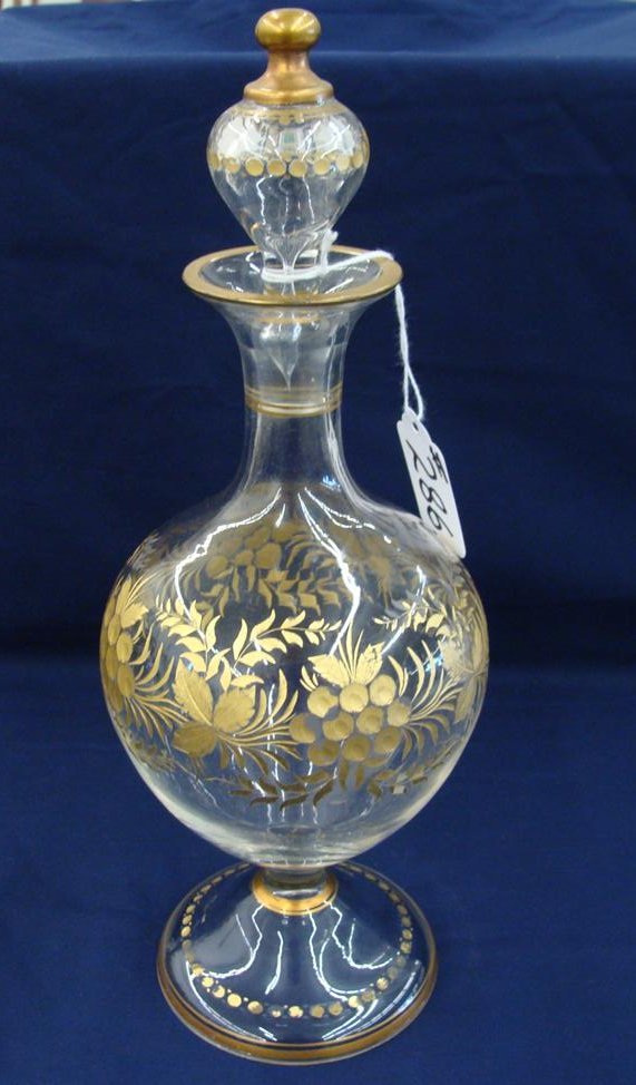 19th Century Blown Art Glass Decanter with All Over: 19th Century Blown Art Glass Decanter with All Over Intaglio Cut Flowers & Vines with Hand painted Gold. 11.5" Ht. Probably Moser; Same Estate as Signed Piece. Auction Estimate $100-200.