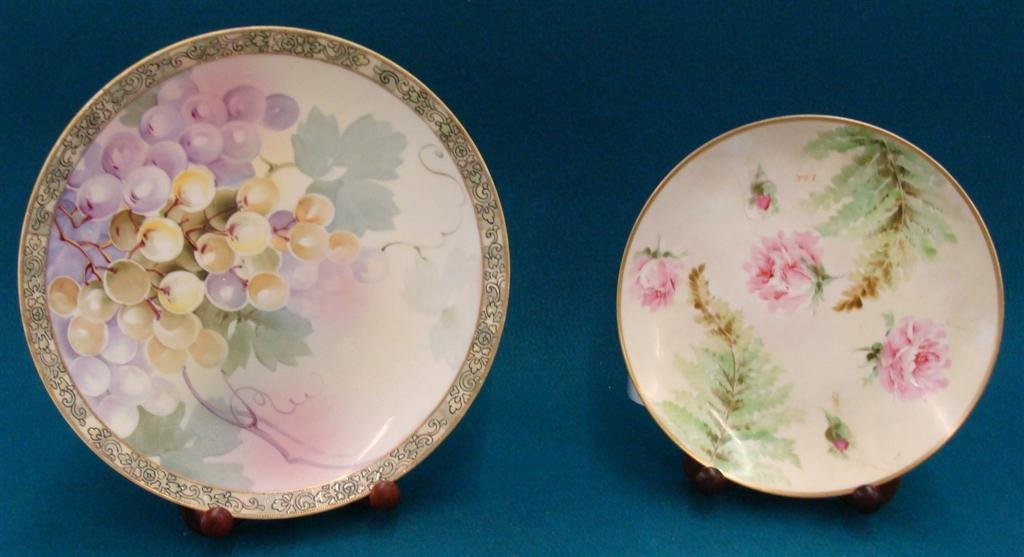 Two Hand Painted Plates; One is 11"; Hand painted: Two Hand Painted Plates; One is 11"; Hand painted Nippon, Signed. The Other is a Hand Painted Ginori Plate; 9" Diameter; Roses and Ferns. The Nippon Plate is Grapes & Vines. Auction Estimate $50- 100.