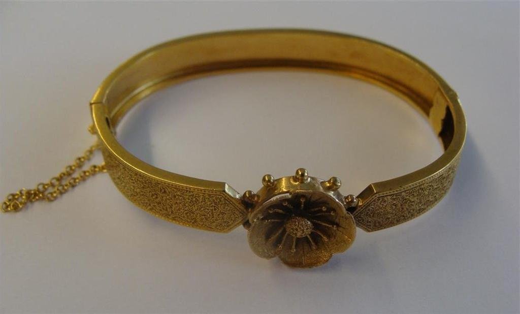 Edwardian 14K Yellow Gold Bracelet with a Flower at the: Edwardian 14K Yellow Gold Bracelet with a Flower at the Top Center. 12.7 Grams. Auction Estimate $500-700.