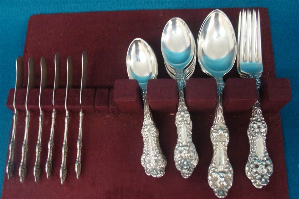27pcs of Sterling Silver Flat Ware by Alvin in the: 27pcs of Sterling Silver Flat Ware by Alvin in the Orange Blossom Pattern. Over 25 Troy Ounces. Auction Estimate $1000-1250.