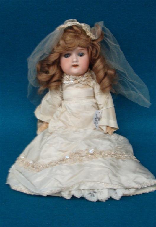 Antique Porcelain German Doll; Floradora A 1 1/2; Sleep: Antique Porcelain German Doll; Floradora A 1 1/2; Sleep Eyes & Open Mouth. In Wedding Dress. Auction Estimate $50-100.
