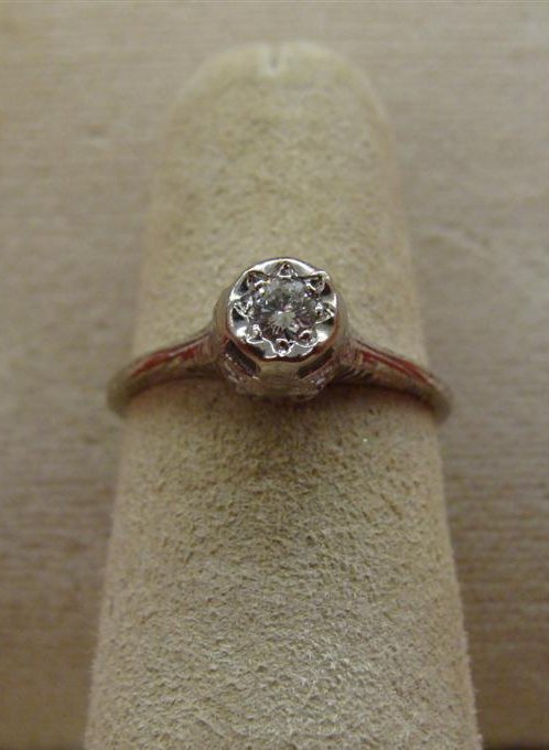Antique 10K White Gold Filigree Ring with Beautiful: Antique 10K White Gold Filigree Ring with Beautiful Diamond; Approximately 1/4ct; Size 6; 1.3 Grams. Auction Estimate $200-300.