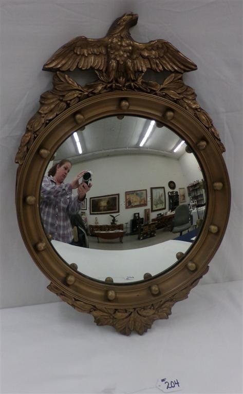 19th Century Federal Style Bull's-eye Mirror; Convex: 19th Century Federal Style Bull's-eye Mirror; Convex Glass; 13 Applied Balls & Gessoed Eagle Crest with Foliage. 24" from Crest to Bottom & 16" Diameter. Auction Estimate $200-400.