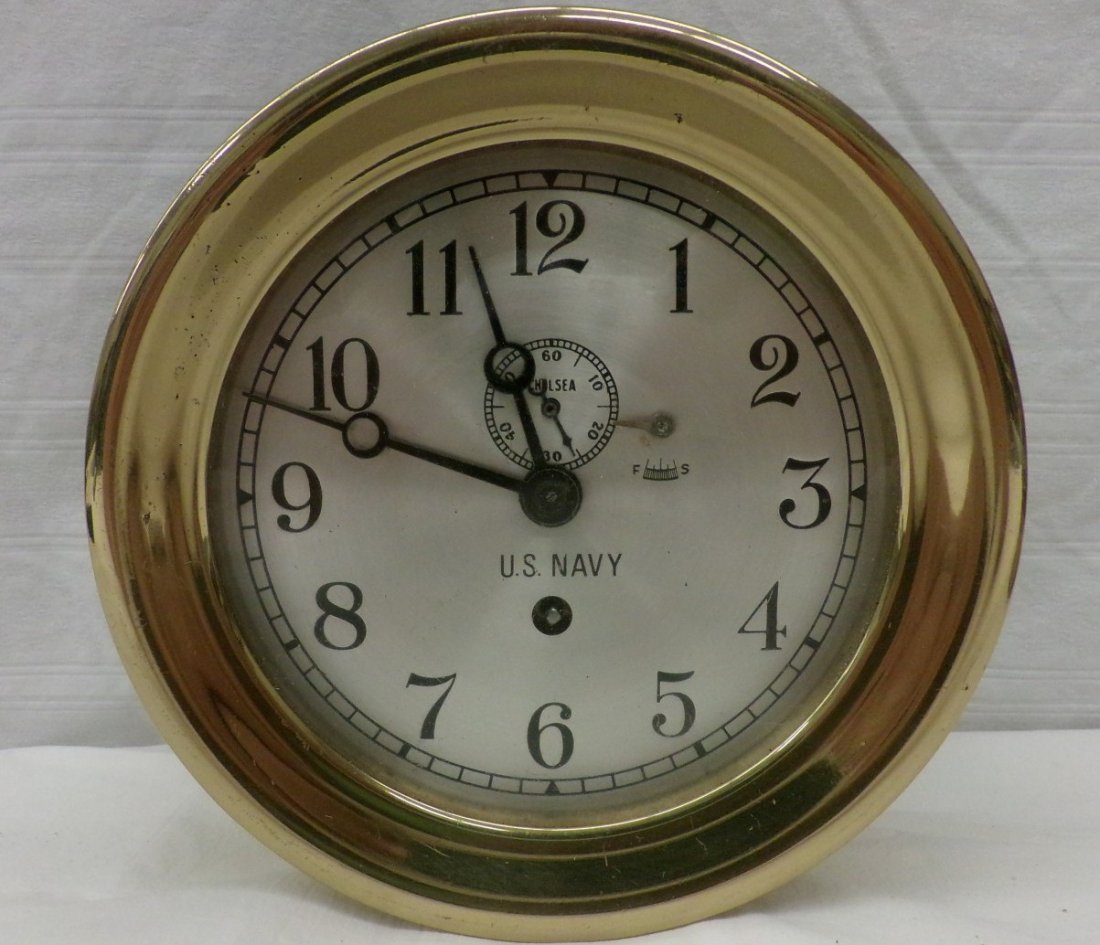 US Navy Ships Clock; Manufactured by Chelsea Clock: US Navy Ships Clock; Manufactured by Chelsea Clock Company; Boston, MA. 7" Diameter, Working Condition. Auction Estimate $200-400.