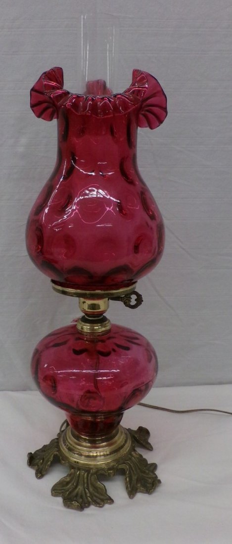 Cranberry Art Glass Lamp; Inverted Thumbprint Design: Cranberry Art Glass Lamp; Inverted Thumbprint Design with a Crimped and Fluted Top Shade; 21" Ht. Auction Estimate $150-300.