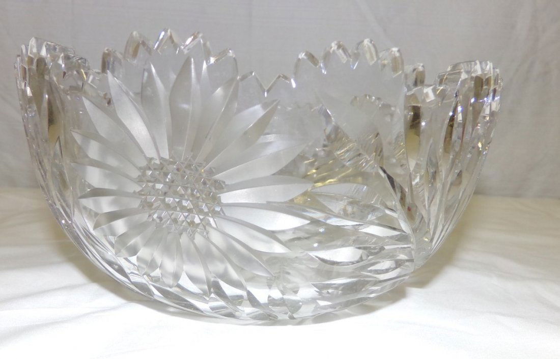 American Brilliant Period Cut Glass Bowl; Intaglio Cut: American Brilliant Period Cut Glass Bowl; Intaglio Cut Sun Flowers with Vine and Leaf Decoration and a Pin Wheel Base. 8" Diameter. Auction Estimate $50-100.
