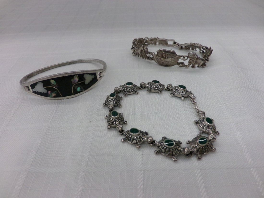3 Sterling Silver Bracelets: Noah's Ark Design, Inlaid: 3 Sterling Silver Bracelets: Noah's Ark Design, Inlaid Mother of Pearl & Abalone and a Turtle Bracelet, Each Turtle has a Malachite Back. Auction Estimate $100-200.