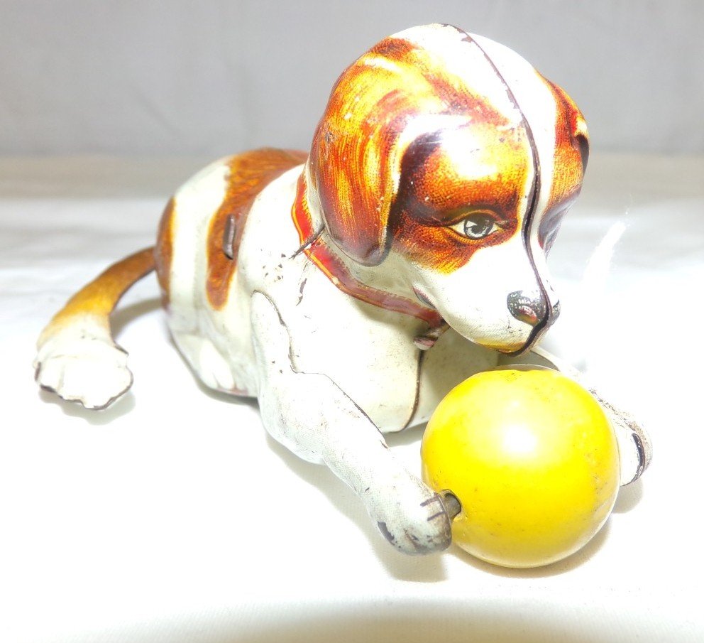 Antique Wind Up Tin Litho Wind Up Toy Dog with Ball; He: Antique Wind Up Tin Litho Wind Up Toy Dog with Ball; He Flips Over Then Walks! Adorable! Working Condition. Auction Estimate $100-200.