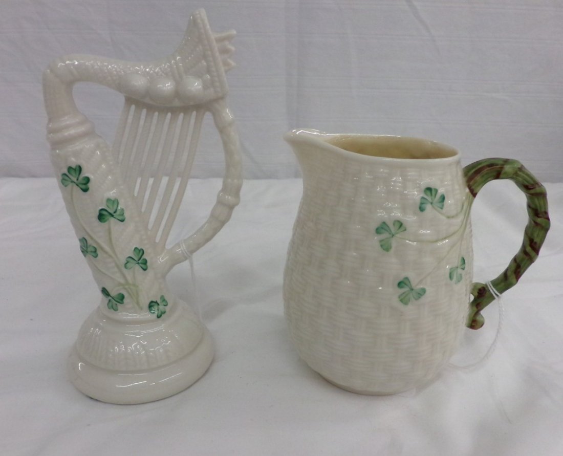 Two Pieces of Irish Belleek in the Shamrock Pattern;: Two Pieces of Irish Belleek in the Shamrock Pattern; Pitcher with Basket Weave Design and a Harp. Auction Estimate $50-100.