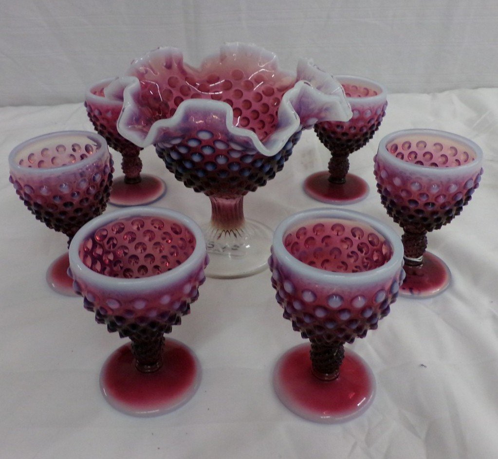 7pcs of Antique Hobnail Amethyst Opalescent Art Glass: 7pcs of Antique Hobnail Amethyst Opalescent Art Glass Includes a Compote and 6 Cordials. Auction Estimate $100-200.