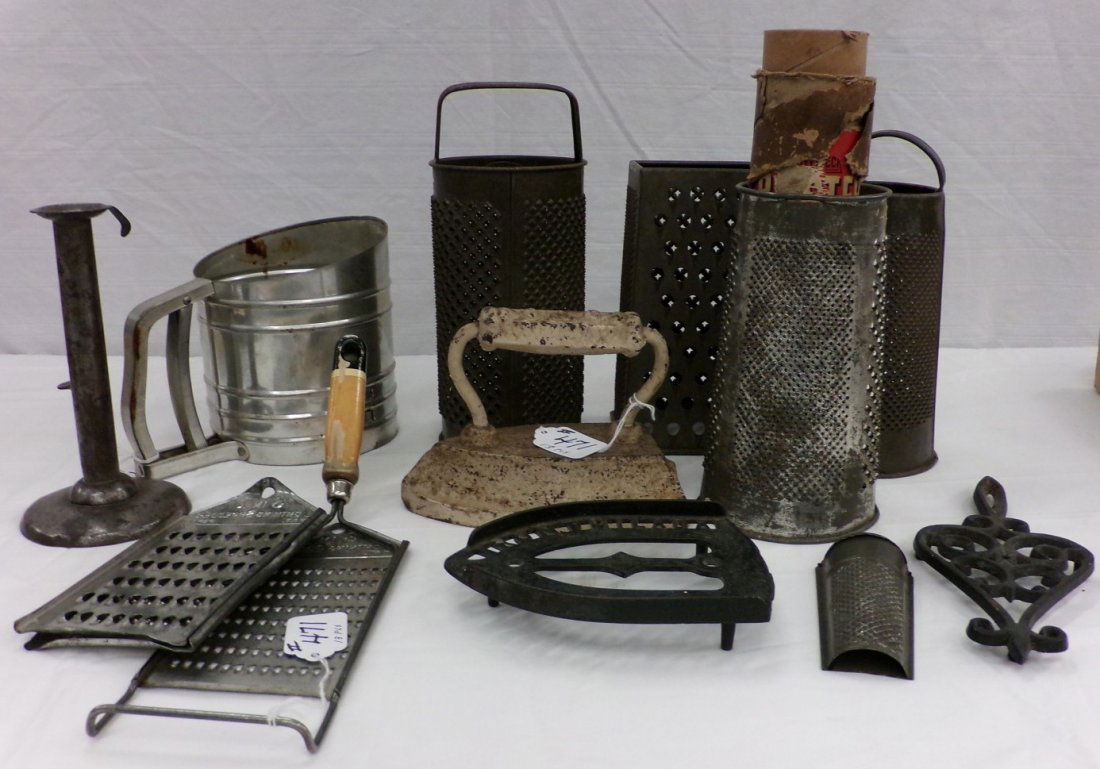 13 Primitive Cooking Items: Includes Graters, Flour: 13 Primitive Cooking Items: Includes Graters, Flour Sifter & Flat irons. Auction Estimate $50-100.