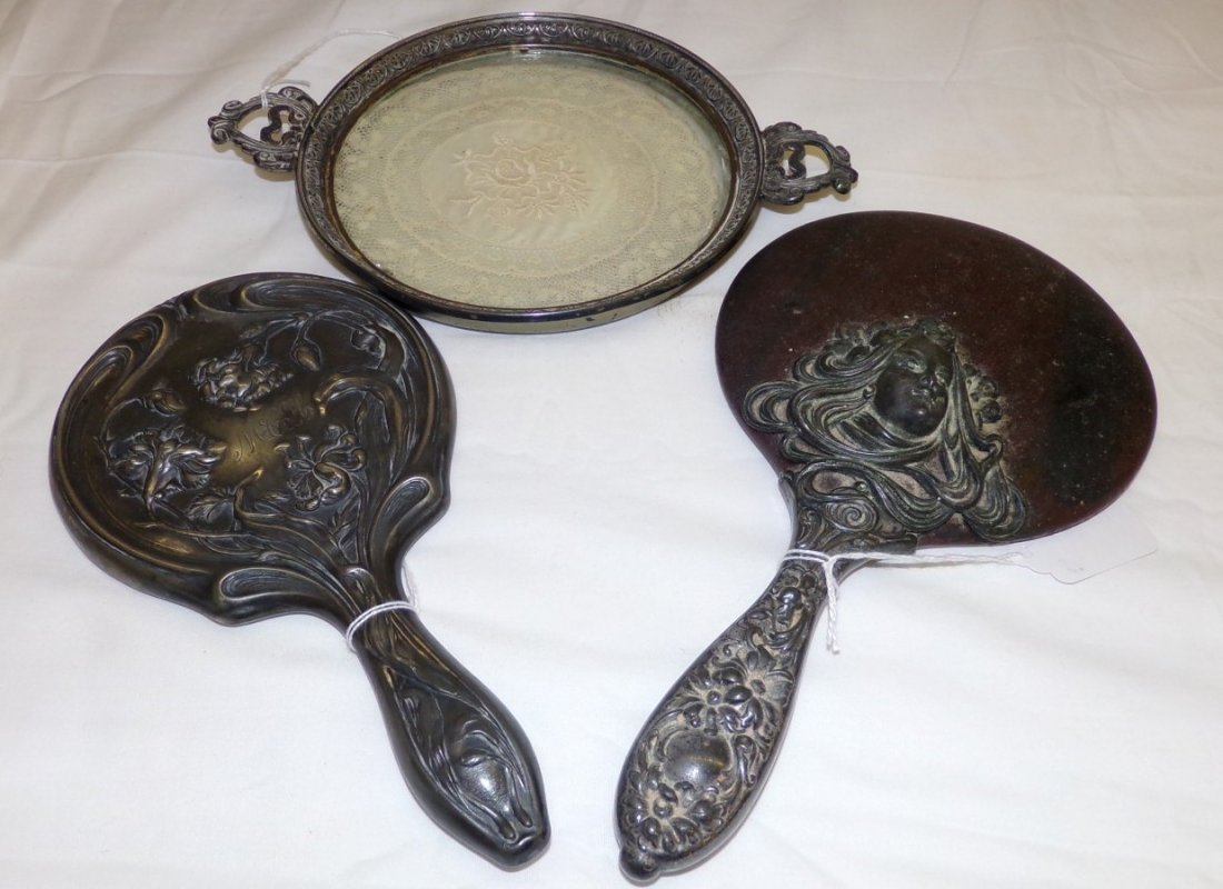 3 Dresser Items: Includes Two mirrors and a Two handled: 3 Dresser Items: Includes Two mirrors and a Two handled Dish with Inlaid Doily. Auction Estimate $50-100.