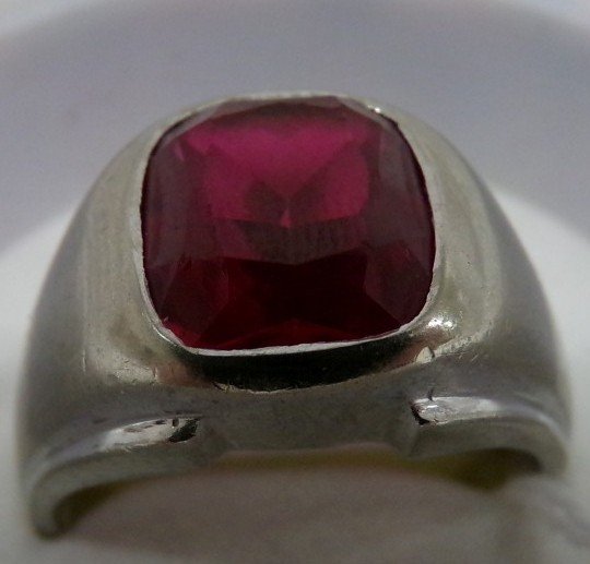 10K White Gold Ring with Red Stone Set In Top; Size 9.5: 10K White Gold Ring with Red Stone Set In Top; Size 9.5 Auction Estimate $200-300.