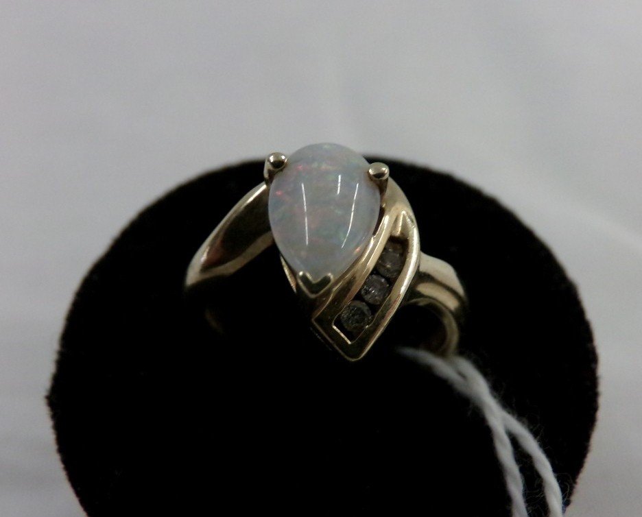 14K Yellow Gold Pear Shaped Opal Ring with Diamond: 14K Yellow Gold Pear Shaped Opal Ring with Diamond Accent; 2.7 Grams; Size 5. Auction Estimate $200-300.