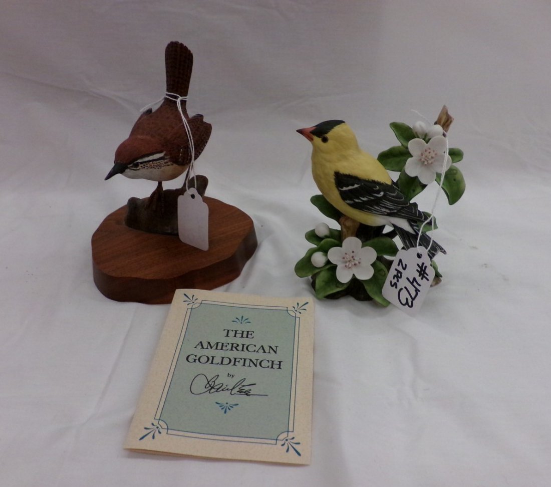 2 Birds: Hand carved Carolina Wren by JD McKinley & a: 2 Birds: Hand carved Carolina Wren by JD McKinley & a Porcelain American Goldfinch. by Basil Ede. Auction Estimate $50-100.