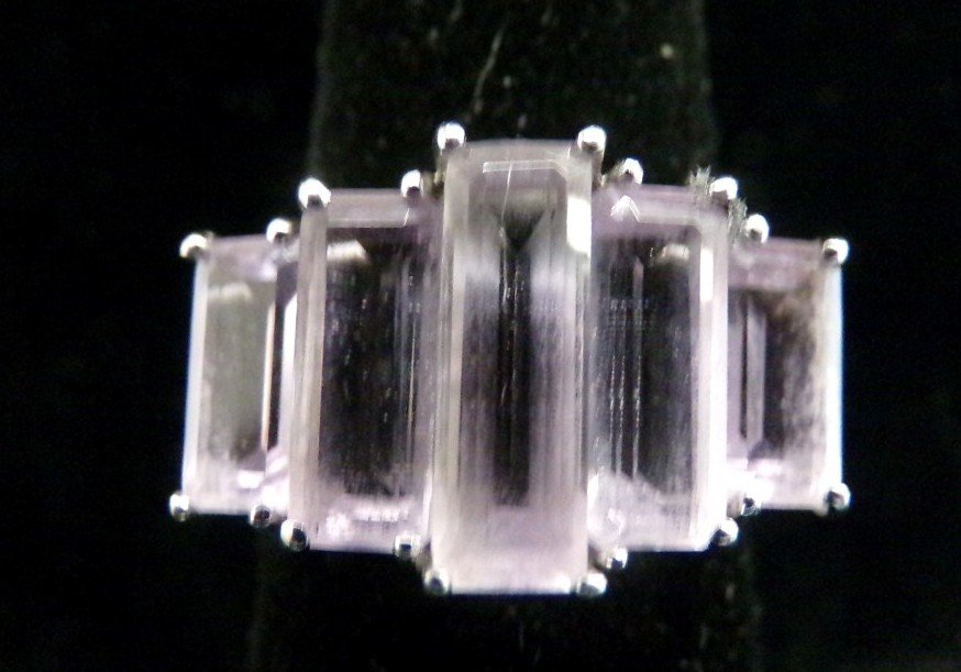 14K White Gold Amethyst Ring with 6 Graduated Size: 14K White Gold Amethyst Ring with 6 Graduated Size Emerald Cut Amethysts Set Across Top; 4.5 Grams. Auction Estimate $300-500.