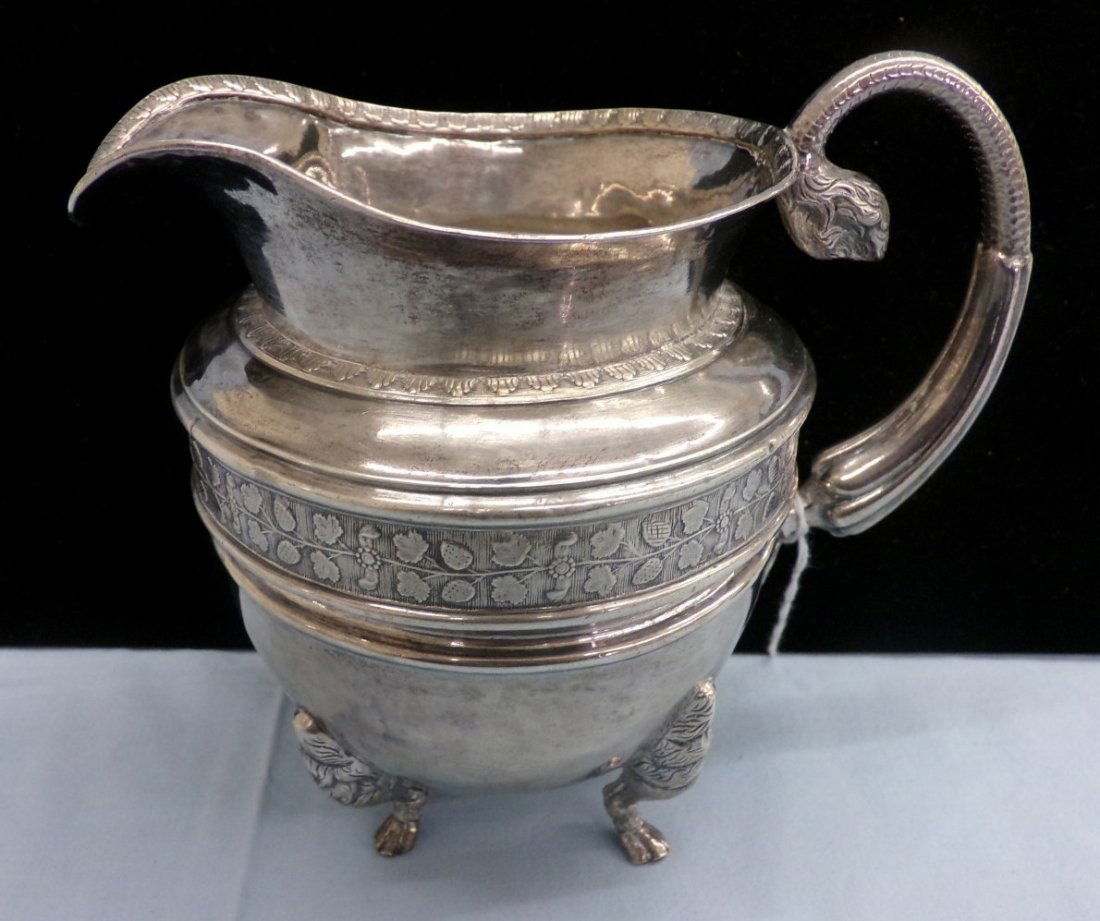 Antique Silver Cream Pitcher with Cow Tail Handle and 4: Antique Silver Cream Pitcher with Cow Tail Handle and 4 Cow Hoof Feet. Auction Estimate $200-300.