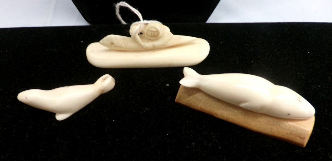 3pcs of Antique Ivory: Seal on Wooden Base, Inuit: 3pcs of Antique Ivory: Seal on Wooden Base, Inuit Carving & Small Seal. Auction Estimate $200-300.