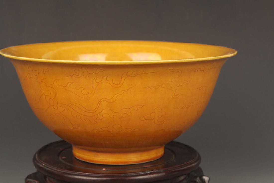 A YELLOW GROUND DRAGON CARVING PORCELAIN BOWL: Ming Dynasty,High:4.0 inch; Diameter: 8.75 inch
