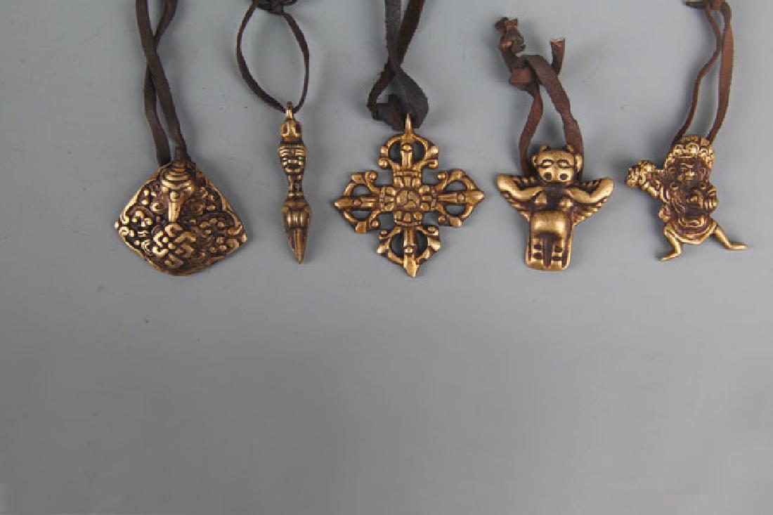 GROUP OF FIVE VAJRA AMULET PENDANT (1 of 3)