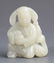 A FINELY CARVED WHITE JADE PENDANT IN FIGURE OF PLAYING