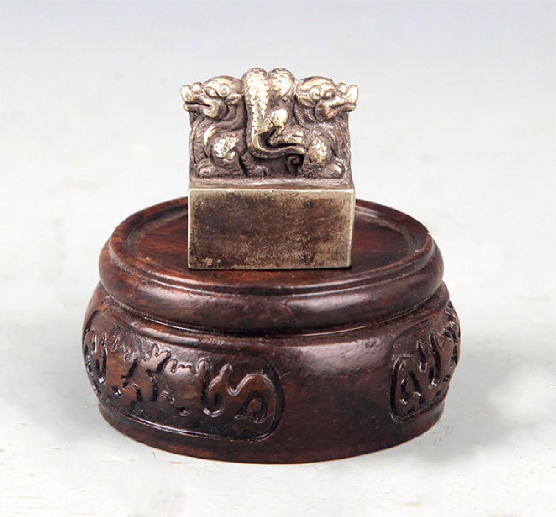 A SILVER PLATED BEAST SHAPED SEAL (1 of 3)