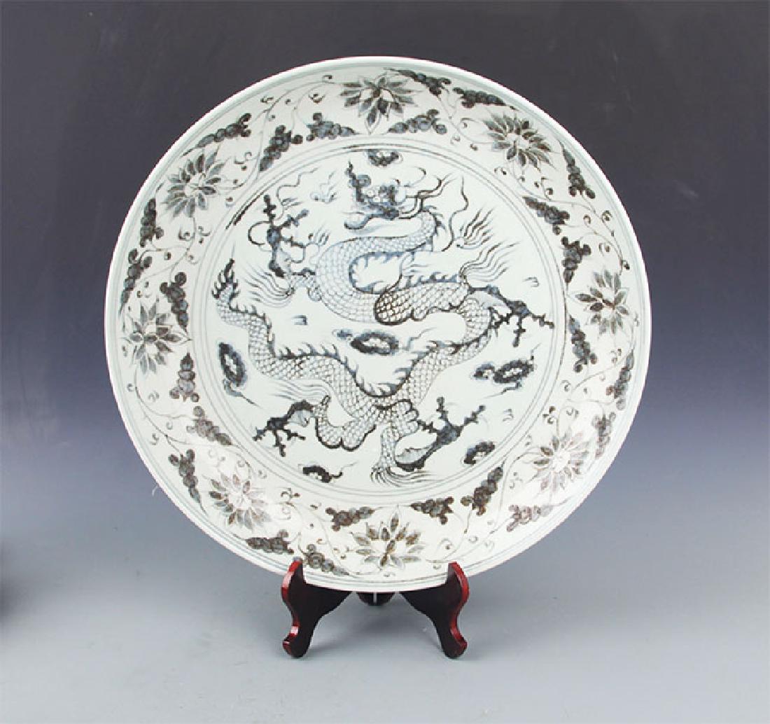 A LARGE BLUE AND WHITE DRAGON PORCELAIN PLATE (1 of 9)