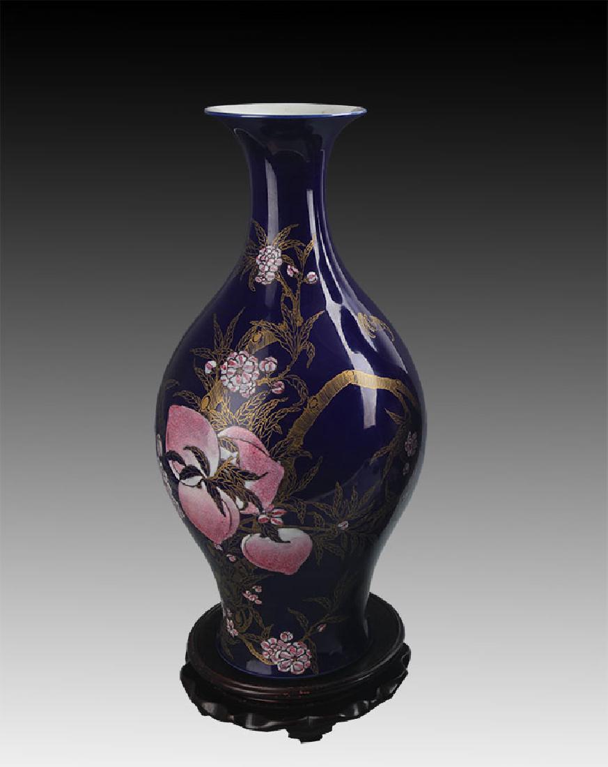 A SACRIFICIAL BLUE GLAZE GILT OLIVE SHAPED BOTTLE (1 of 9)