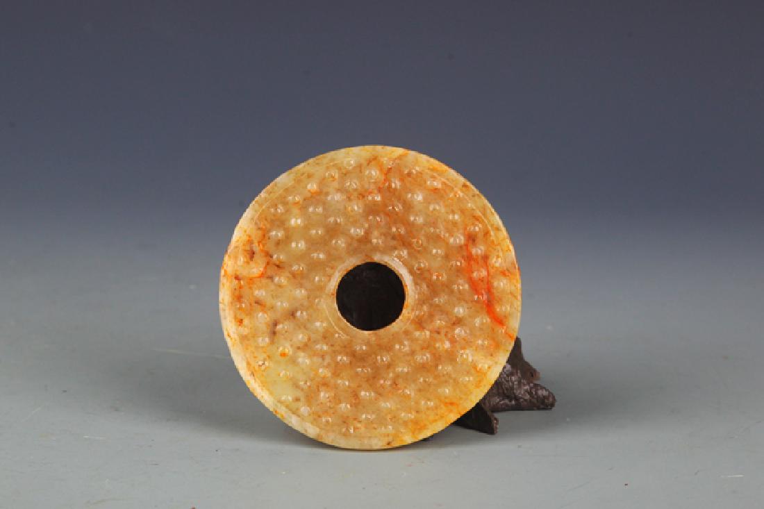 A WARRING STATES PERIOD STYLE ROUND JADE PENDANT (1 of 3)