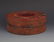 A ROUND GILT LACQUERED WOOD ROYAL NECKLACE BOX